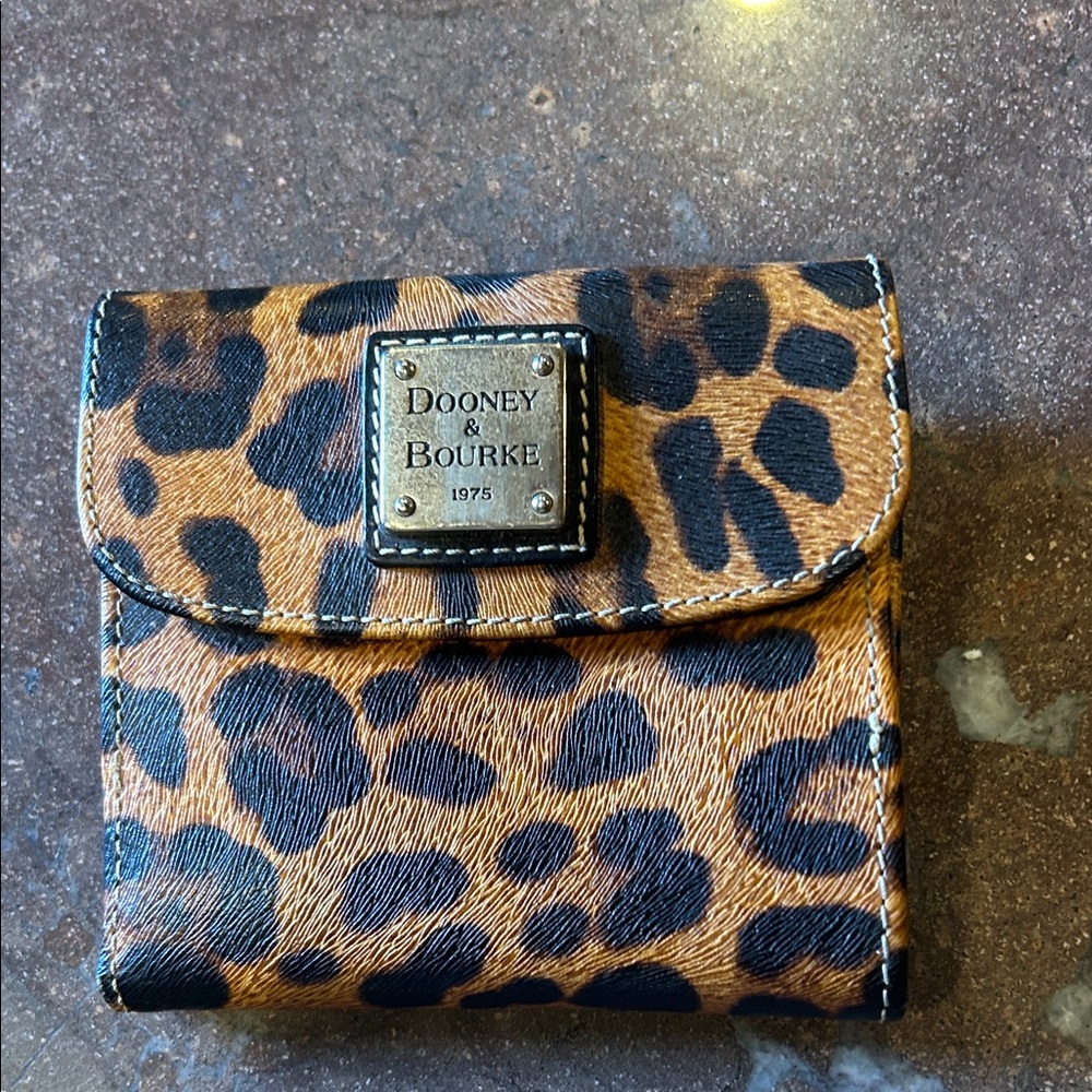 Dooney & Bourke Animal Print Wallet never been used before from 2008 ?